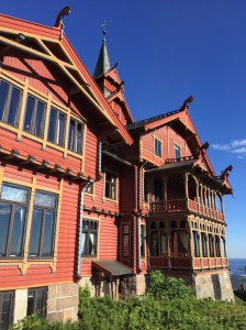 The Dragon-style Holmenkollen Hotel on a sunny day.
