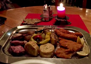 Our overladed platter dished up a little bit of everything: wiener schnitzel, port, dumplings, sausages, and chicken.