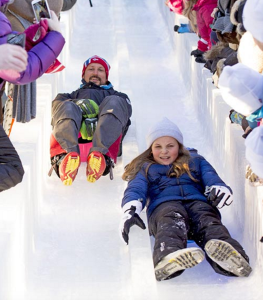 Crown Prince Haakon and his daughter Princess Ingrid Alexandra take to the ice slide. © Rex from Hello! magazine.