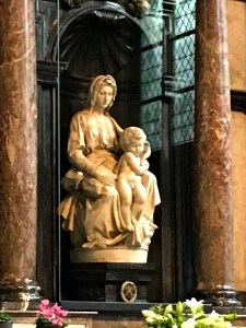 A wealthy Bruges businessman bought the statue in Tuscany and his tomb rests beneath it.