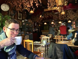 Matthew enjoys some sun on his face inside the cute De Windmollen Cafe.
