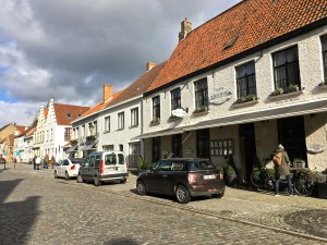 Matthew parks the tandem in front of Tante Marie's, which is situation along the quaint main thoroughfare in Damme.