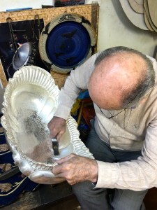 Here, Kapik Usta (Usta means "Master") works the shape of a Baroque-styled bowl for holding fruit.